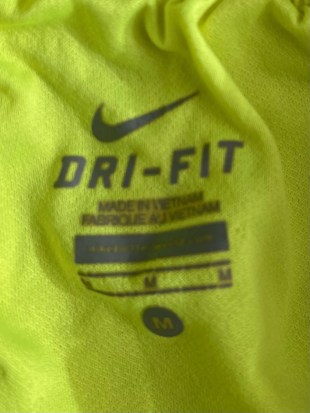 Nike women’s medium tempo running shorts highlighter yellow with black trim